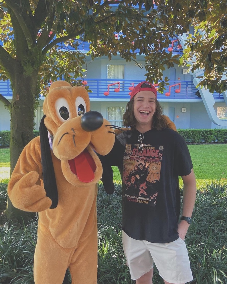 Brent Dolan with Pluto mascot at Disney